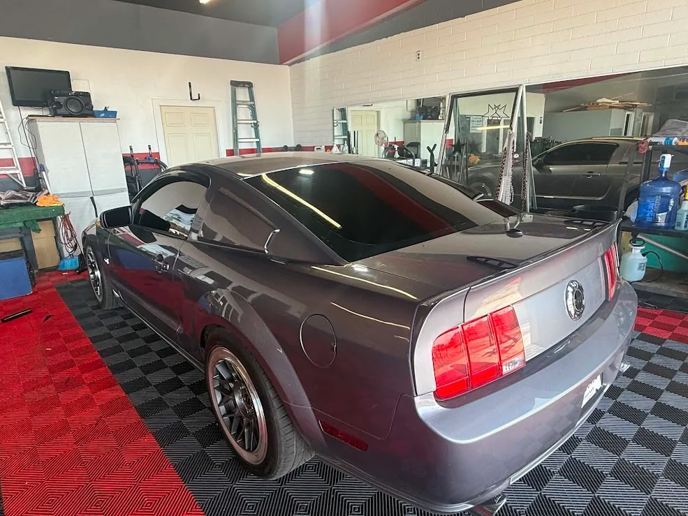 Gray Ford Mustang GT with dark ceramic window tint